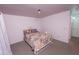 Bedroom features a decorative quilt, a window, and neutral walls, designed for peaceful relaxation and comfort at 17620 N 17Th Pl # 36, Phoenix, AZ 85022