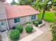 Aerial view of townhome shows inviting walkway, front door, and mature landscaping at 17620 N 17Th Pl # 36, Phoenix, AZ 85022