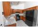 Well-maintained kitchen boasts black appliances, granite countertops, and ample cabinet space at 17620 N 17Th Pl # 36, Phoenix, AZ 85022