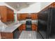 Classic kitchen with black appliances, granite countertops, and ample cabinet storage at 17620 N 17Th Pl # 36, Phoenix, AZ 85022