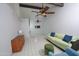 Open and airy living space with high ceilings, a comfortable sofa, and tiled flooring at 17620 N 17Th Pl # 36, Phoenix, AZ 85022