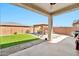 Enjoy the lovely backyard featuring artificial turf, an outdoor kitchen area, and cozy gazebo at 18394 W Lupine Ave, Goodyear, AZ 85338