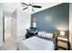 Bedroom features a deep accent wall, woven blind and an ensuite bathroom at 18394 W Lupine Ave, Goodyear, AZ 85338