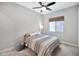 Cozy bedroom with a ceiling fan and a window, offering a relaxing atmosphere at 18394 W Lupine Ave, Goodyear, AZ 85338