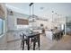 Well-appointed kitchen with island, stainless steel appliances and an adjacent dining area at 18394 W Lupine Ave, Goodyear, AZ 85338