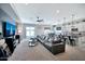 Open floor plan with a living room that flows to the kitchen with an eat-in kitchen island at 18394 W Lupine Ave, Goodyear, AZ 85338