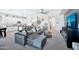Spacious living room with a modern open layout concept, including a view of the kitchen at 18394 W Lupine Ave, Goodyear, AZ 85338