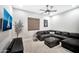 Living room with a comfortable sectional sofa, TV and decorative accents at 18394 W Lupine Ave, Goodyear, AZ 85338