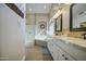 Bright bathroom featuring a shower, tub, double vanity, and wood-look tile floor at 1893 W Canary Way, Chandler, AZ 85286