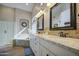 Elegant bathroom with double vanity, granite countertops, a glass shower, and a soaking tub at 1893 W Canary Way, Chandler, AZ 85286