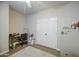 Bright bedroom with wood-look floors, ceiling fan, desk, and storage cabinet with supplies at 1893 W Canary Way, Chandler, AZ 85286