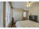 Bedroom with a neutral color scheme, light wood floors, ceiling fan, and plenty of natural light at 1893 W Canary Way, Chandler, AZ 85286