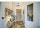Inviting entryway features a decorative mirror, stylish lighting, and neutral decor at 1893 W Canary Way, Chandler, AZ 85286