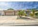 Beautiful home with a two-car garage, desert landscaping, and stone pathway at 1893 W Canary Way, Chandler, AZ 85286