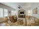 Bright living room featuring a ceiling fan, recessed lighting, sofas, chair, and built in shelving at 1893 W Canary Way, Chandler, AZ 85286