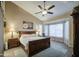 Bedroom with a ceiling fan, carpet, a large bed, and bright natural light from large windows at 1893 W Canary Way, Chandler, AZ 85286