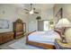A bedroom featuring a large bed, two dressers, a ceiling fan, and bright natural light at 1893 W Canary Way, Chandler, AZ 85286