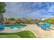 Inviting backyard pool area with comfortable seating and lush, mature landscaping around the area at 1893 W Canary Way, Chandler, AZ 85286