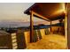 Charming balcony featuring stone flooring and a decorative barrier, offering stunning sunset and city views at 21 W Beryl Ave, Phoenix, AZ 85021