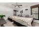 Bright bedroom with two beds, ceiling fan, and stylish decor offers a cozy and inviting space at 21 W Beryl Ave, Phoenix, AZ 85021