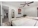 Bright bedroom featuring two beds, neutral decor, and an open doorway leading to other rooms at 21 W Beryl Ave, Phoenix, AZ 85021