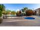 Relaxing community pool area featuring a hot tub, seating, and desert landscaping at 21 W Beryl Ave, Phoenix, AZ 85021