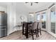 Cozy dining area featuring an elegant table and chairs, with natural light streaming in from the French doors at 21 W Beryl Ave, Phoenix, AZ 85021