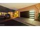 Attractive single-story home with desert landscaping and a modern garage door at twilight at 21 W Beryl Ave, Phoenix, AZ 85021