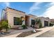Charming single-story home with desert landscaping and a modern garage door under a blue sky at 21 W Beryl Ave, Phoenix, AZ 85021