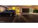 Beautiful single-story home with a modern garage door and well-manicured landscaping at twilight at 21 W Beryl Ave, Phoenix, AZ 85021