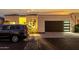 Beautiful single-story home with a modern garage door and well-manicured landscaping at twilight at 21 W Beryl Ave, Phoenix, AZ 85021