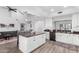 Open kitchen with an island, modern appliances, and stylish finishes, perfect for entertaining at 21 W Beryl Ave, Phoenix, AZ 85021