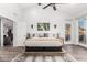 Vaulted ceiling in primary bedroom with floor-to-ceiling windows and access to the back yard at 21 W Beryl Ave, Phoenix, AZ 85021