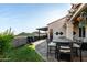 Inviting outdoor patio with comfortable seating, dining area, and desert landscaping at 21 W Beryl Ave, Phoenix, AZ 85021