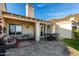 Spacious outdoor patio with comfortable seating, dining area, and charming desert landscaping at 21 W Beryl Ave, Phoenix, AZ 85021