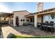 Spacious outdoor patio with comfortable seating, dining area, and charming desert landscaping at 21 W Beryl Ave, Phoenix, AZ 85021