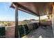 Covered patio with brick wall offers scenic mountain and neighborhood views at 21 W Beryl Ave, Phoenix, AZ 85021
