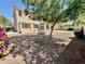 Landscaped backyard with patio, pergola, fire pit, and mature landscaping, perfect for outdoor entertaining at 2461 E Binner Dr, Chandler, AZ 85225