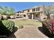 Expansive backyard featuring a patio area, lush greenery, and manicured landscaping, offering privacy and serenity at 2461 E Binner Dr, Chandler, AZ 85225