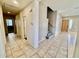 Open entryway with tiled floors, stairs, and a wood front door at 2461 E Binner Dr, Chandler, AZ 85225