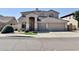 Charming two-story home boasts a stylish facade, tiled roof and an arched entryway at 2461 E Binner Dr, Chandler, AZ 85225