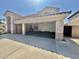 Attached garage with storage cabinets and ample space for multiple vehicles and household items at 2461 E Binner Dr, Chandler, AZ 85225