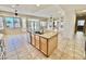 Open-concept kitchen featuring an island with a sink and lots of cabinet storage at 2461 E Binner Dr, Chandler, AZ 85225
