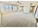 Spacious living room with plush carpeting, an open layout, and natural light from windows with blinds at 2461 E Binner Dr, Chandler, AZ 85225