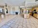 Spacious room showcases a fireplace, built-in shelves, an open-concept kitchen with an island, and tile/wood flooring at 2461 E Binner Dr, Chandler, AZ 85225