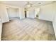 Large living room features soft carpeting, an open floor plan, and plenty of natural light from multiple rooms at 2461 E Binner Dr, Chandler, AZ 85225