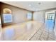 Spacious, light-filled living area with sleek laminate flooring and large bright windows at 2461 E Binner Dr, Chandler, AZ 85225