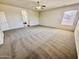 The living room features plush carpeting, natural light, and an open layout that leads to other areas of the home at 2461 E Binner Dr, Chandler, AZ 85225