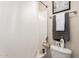 This bathroom has a shower, toilet, chrome towel rack, and decorative wall art at 2738 E Silversmith Trl, San Tan Valley, AZ 85143