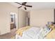 A bright bedroom features an attached bathroom and walk-in closet for extra storage at 2738 E Silversmith Trl, San Tan Valley, AZ 85143